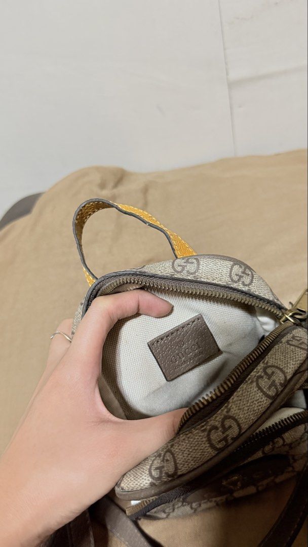 Gucci Neo Vintage GG Supreme Mini (Category: Luxury Bags & Wallets) located in San Pablo. Submitted by dees_collection (Listing ID 1442522949, Image 3). Description: Material: Crafted from the brand’s iconic beige and ebony GG Supreme coated canvas with brown leather trims. Hardware & Details: Features a distinctive oval leather patch with a metal feline head and the Gucci logo emblazoned across the front. Accents: Designed with an adjustable bro