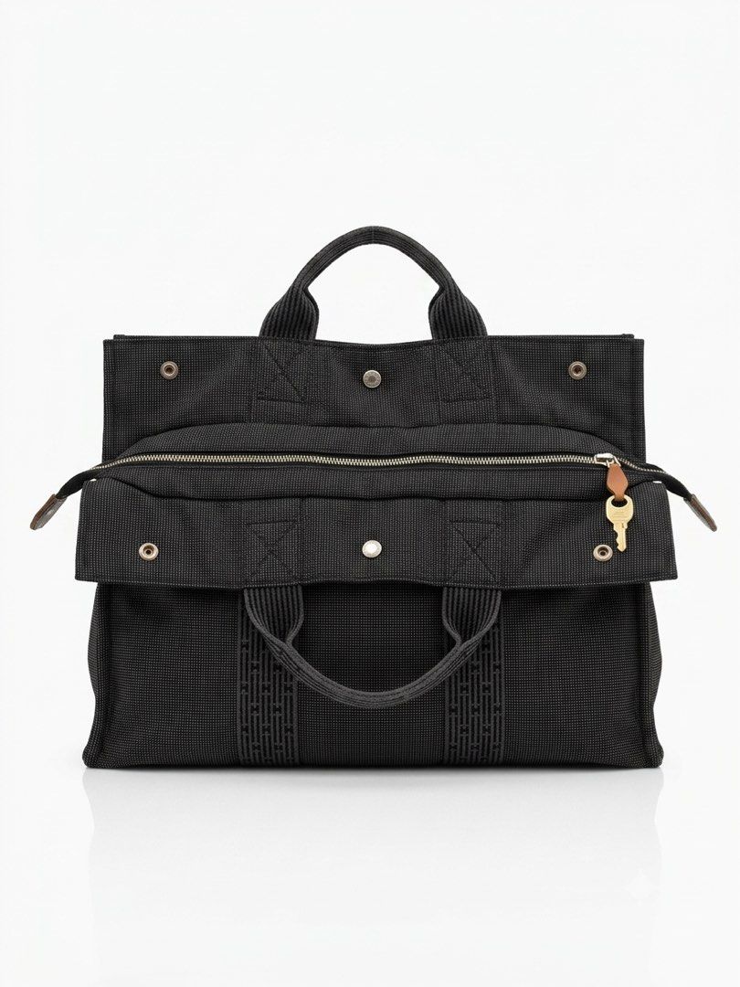 Hermes Herbag Zip Black Canvas Tote Bag (Category: Luxury Bags & Wallets) located in Davao. Submitted by brobewerty40648 (Listing ID 1442382609, Image 1). Description: - Authentic Hermes black canvas tote bag - Secure zip-top closure - Elegant leather trim - Includes padlock and key for added security - Iconic Hermes logo subtly integrated into the fabric - Ideal for everyday use or travel.