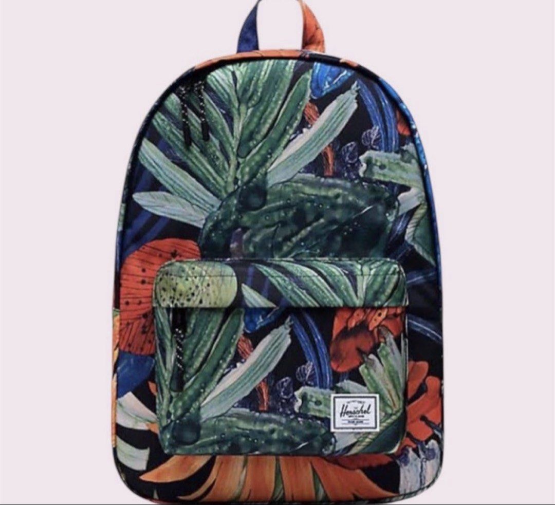 Herschel Classic Mid Watercolor Flower Backpack (Category: Backpacks) located in Rizal. Submitted by cassappl (Listing ID 1442371051, Image 1). Description: - Cool floral print backpack from Herschel - Features a convenient front zip pocket - Ideal for school or everyday adventures - Includes the signature Herschel logo tag.