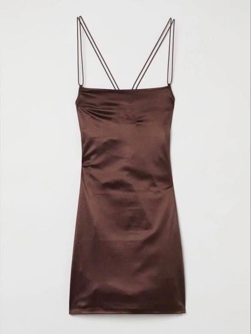 H&M Brown Satin Spaghetti Strap Mini Dress (Category: Dresses) located in Manila. Submitted by stargirl05 (Listing ID 1442406775, Image 1). Description: - Brown satin mini dress from H&M - Features thin spaghetti straps that criss-cross at the back - Bodycon fit - Versatile for dressing up or down - Ideal for a night out or special occasion.