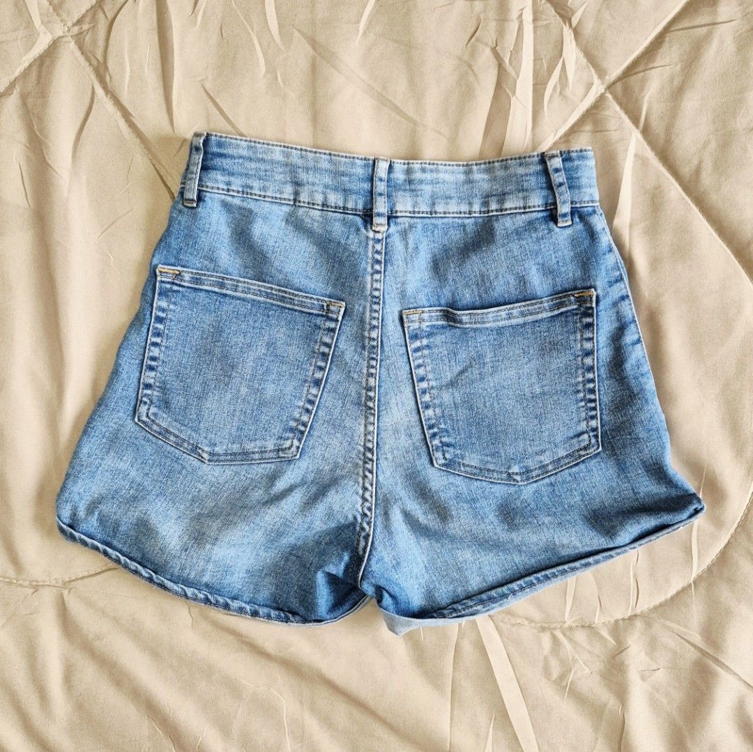 H&M Divided High-Waisted Denim Shorts (Category: Shorts) located in Quezon City. Submitted by akcstuff (Listing ID 1442390856, Image 2). Description: Color: Light wash denim Size: US 4 / Eur 34 / Can 160 - High-waisted fit - Rolled hem detail - Classic five-pocket styling - Button and zip fly closure - Versatile for casual wear.