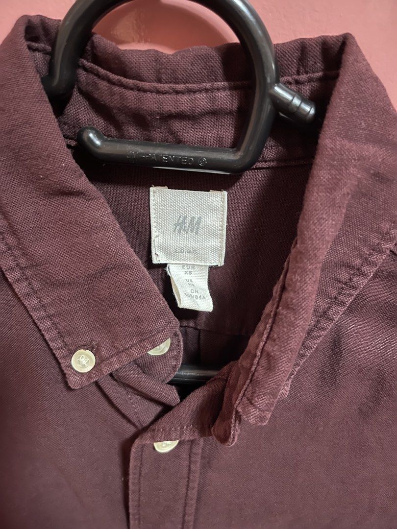 H&M Long Sleeve Button Down Shirt Burgundy (Category: Formal Shirts) located in Imus. Submitted by dffabellon (Listing ID 1442482685, Image 2). Description: - Burgundy long sleeve shirt from H&M - Button-down style with collar - Single chest pocket - Versatile for casual or smart casual outfits - Pairs well with jeans or chinos.