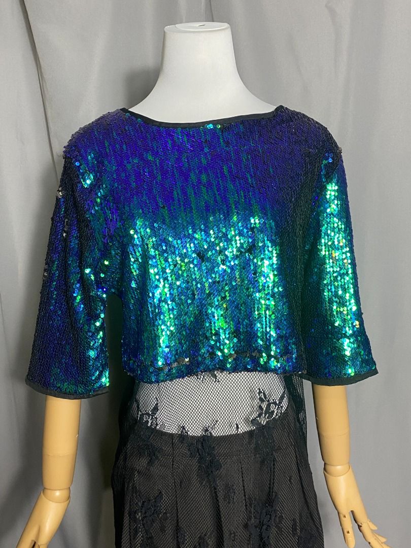 HQ Sequined Green Top with lace hem (Category: Blouses) located in Las Pinas. Submitted by ipickyou (Listing ID 1442488557, Image 1). Description: Unwashed Condition: 10/10 𝗣𝗿𝗶𝗰𝗲: ₱𝟲𝟴𝟬 𝗠𝗲𝗮𝘀𝘂𝗿𝗲𝗺𝗲𝗻𝘁𝘀 𝘄𝗵𝗲𝗻 𝗹𝗮𝗶𝗱 𝗳𝗹𝗮𝘁: -Shoulder to shoulder: 15” -Armpit to armpit: 19” -Length: H 15 1/2”, L 43”.