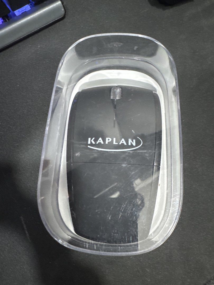 Kaplan Wireless Optical Computer Mouse (Category: Mouse & Mousepads) located in Singapore. Submitted by agentrox (Listing ID 1442512349, Image 1). Description: - Black Kaplan wireless optical mouse - Works well - Easy plug and play setup - Ideal for everyday computer use - Comes with original clear plastic case.