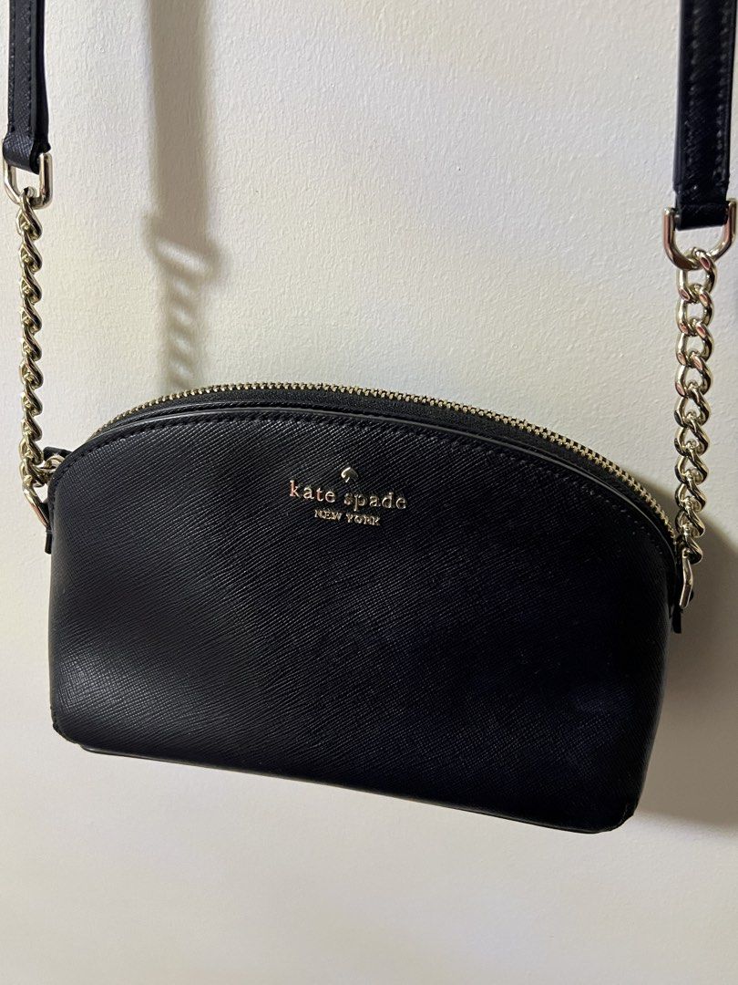 Kate Spade Black Leather Crossbody Bag (Category: Cross-body Bags) located in Dagupan City. Submitted by kamilpicks (Listing ID 1442404399, Image 2). Description: - Authentic Kate Spade black leather crossbody bag - Elegant gold chain strap - Compact size, ideal for carrying essentials - Secure zipper closure - Convenient interior pocket - Perfect for casual day or evening use -STILL NEGOTIABLE.
