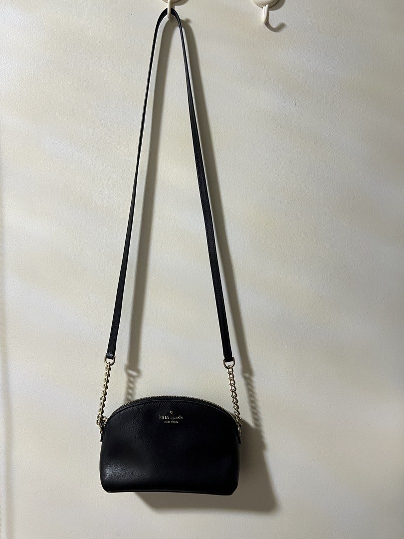 Kate Spade Black Leather Crossbody Bag (Category: Cross-body Bags) located in Dagupan City. Submitted by kamilpicks (Listing ID 1442404399, Image 1). Description: - Authentic Kate Spade black leather crossbody bag - Elegant gold chain strap - Compact size, ideal for carrying essentials - Secure zipper closure - Convenient interior pocket - Perfect for casual day or evening use -STILL NEGOTIABLE.