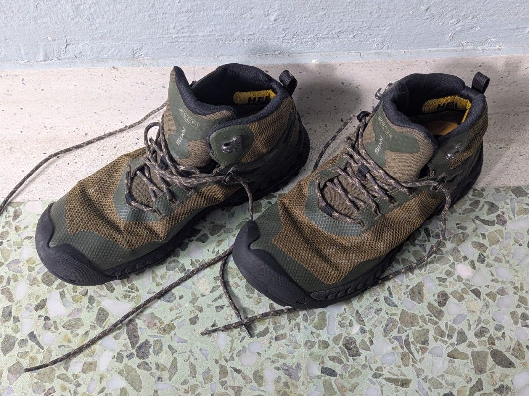 KEEN NXIS Waterproof Hiking Boots - Men's Size 9 (Category: Boots) located in Singapore. Submitted by ozz (Listing ID 1442419586, Image 1). Description: - KEEN NXIS hiking boots - Mid-height for excellent ankle support - Waterproof construction to keep feet dry - Stylish green and brown camouflage pattern - Perfect for trails and outdoor adventures - Laces included - purchased in 2022 - done not more than 130kms - Get ready for your next hike! - 