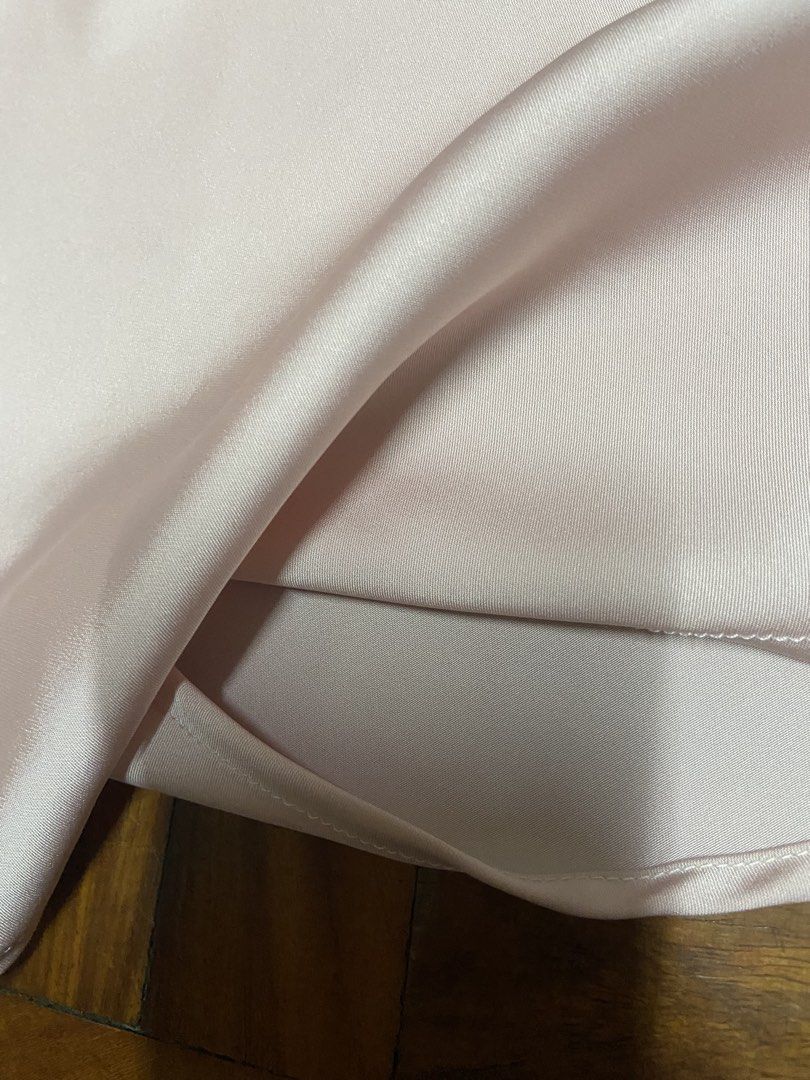 Satin Halter Neck Top (Category: Sleeveless) located in Mandaluyong City. Submitted by decluttermyitems (Listing ID 1442465455, Image 2). Description: - Light pink satin fabric with a beautiful sheen. - Elegant halter neck design. - Chic keyhole detail at the back. - Slight flare at the hem for a flattering silhouette. - Perfect for dressing up or down. Size xs-s Update: only baby blue avail.