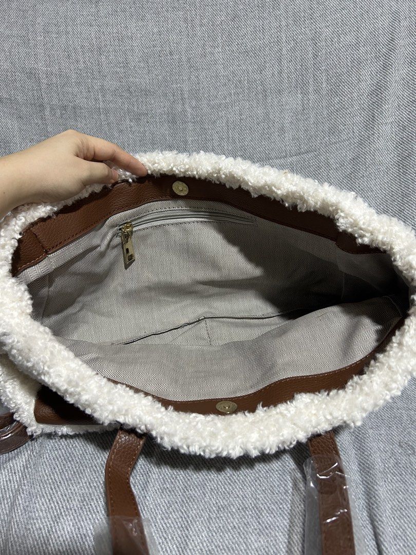 Loewe Shearling Tote Bag with Leather Trim (Category: Luxury Bags & Wallets) located in Santa Maria. Submitted by gelato76628 (Listing ID 1442402566, Image 2). Description: [BRAND NEW] Loewe Shearling Tote Bag with Leather Trim Size: 15 inches width, 8 inches height Color: Off White/Brown Inclusions: Dust bag and long strap Loc: Bulacan area, near Philippine Arena NOTE: Buyer shoulders the shipping fee. For same day delivery, the buyer must send 