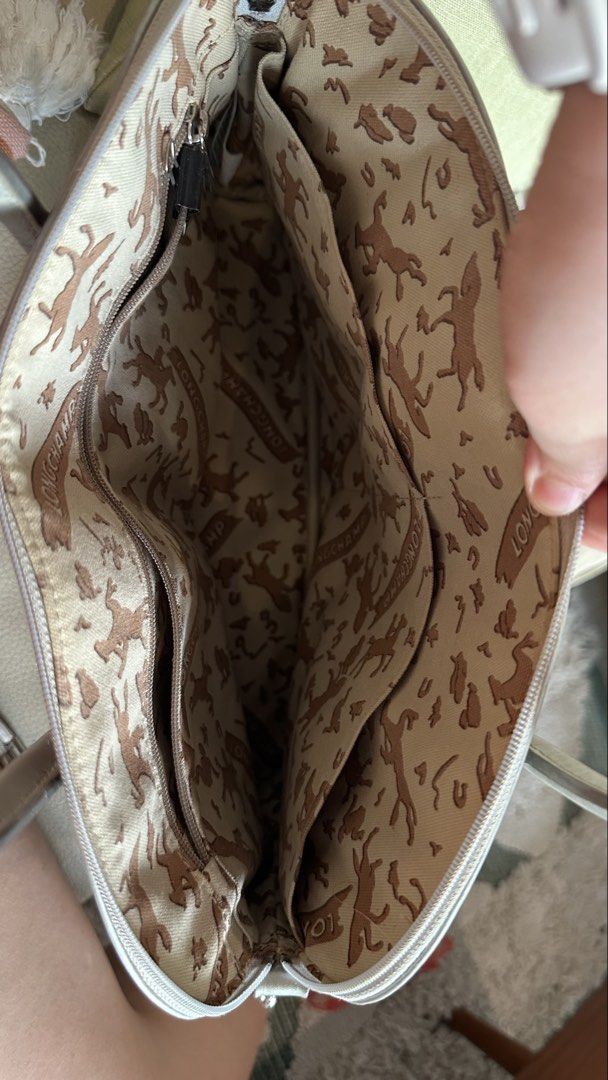 LONGCHAMP Structured Satchel / Bowling Bag with Shoulder Strap (Category: Luxury Bags & Wallets) located in Cebu City. Submitted by calligraphybyden (Listing ID 1442416107, Image 3). Description: Authentic Longchamp structured satchel in a versatile silver shade. One of the best features of this bag is its structured design—it stands upright beautifully on its own and keeps its shape even when not fully packed. Perfect for those who prefer a bag 