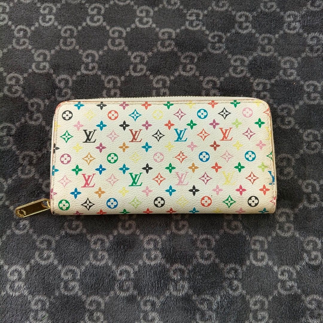 Louis Vuitton Takashi Murakami Monogram Multicolore Zippy Wallet (Category: Luxury Bags & Wallets) located in Iloilo. Submitted by bellabeigefinds (Listing ID 1442449985, Image 2). Description: Description: (#C60017) Selling this vintage Louis Vuitton x Takashi Murakami Monogram Multicolore Zippy Wallet in white/vibrant pink interior. A beautiful, iconic Y2K collaboration piece perfect for everyday use or a restoration project..