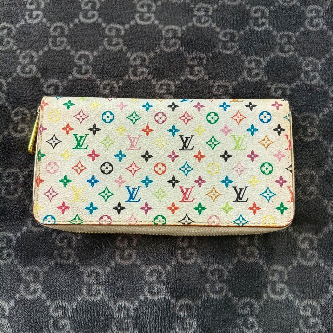 Louis Vuitton Takashi Murakami Monogram Multicolore Zippy Wallet (Category: Luxury Bags & Wallets) located in Iloilo. Submitted by bellabeigefinds (Listing ID 1442449985, Image 1). Description: Description: (#C60017) Selling this vintage Louis Vuitton x Takashi Murakami Monogram Multicolore Zippy Wallet in white/vibrant pink interior. A beautiful, iconic Y2K collaboration piece perfect for everyday use or a restoration project..