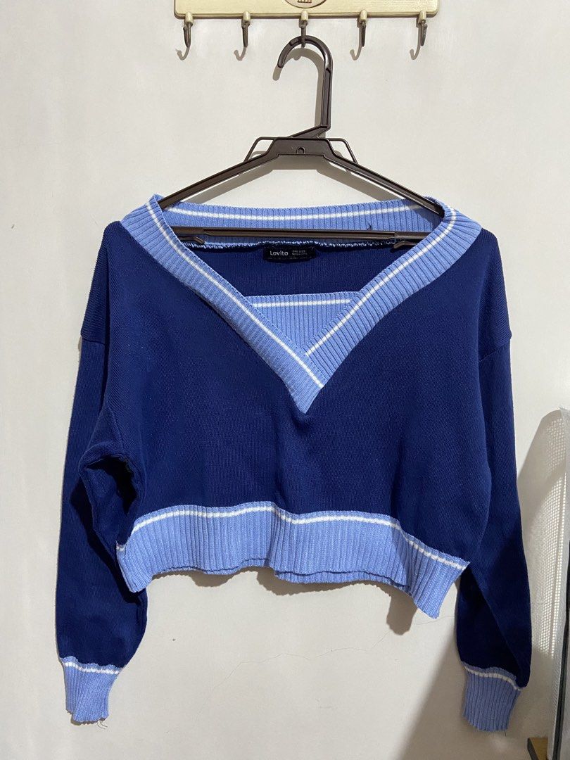 Lovito Blue V-Neck Cropped Sweater One Size (Category: Coats, Jackets and Outerwear) located in Valenzuela. Submitted by decluttermaniac (Listing ID 1442353505, Image 1). Description: - Lovito blue cropped sweater - V-neck design with light blue and white striped trim - Ribbed cuffs and hem - One size fits most - Versatile for layering or standalone wear.