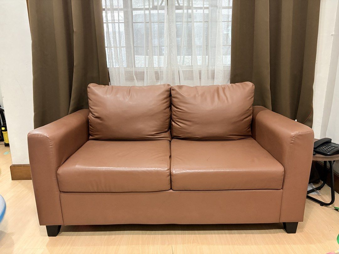 Mandaue Foam Chino 2-Seater Sofa (Category: Sofas) located in Paranaque City. Submitted by v.punay (Listing ID 1442365433, Image 1). Description: Mandaue Foam Chino 2-Seater Sofa ✔️ Tully Brown ✔️ Leather ✔️ Purchased January 2026 ✔️ With hidden storage compartments ✔️ Excellent condition 💰 ₱14,500 (Orig. ₱20,100) 📍 Better Living, Parañaque 🚚 Pick-up only RFS: Moving out and upgrading to a bigger sofa..