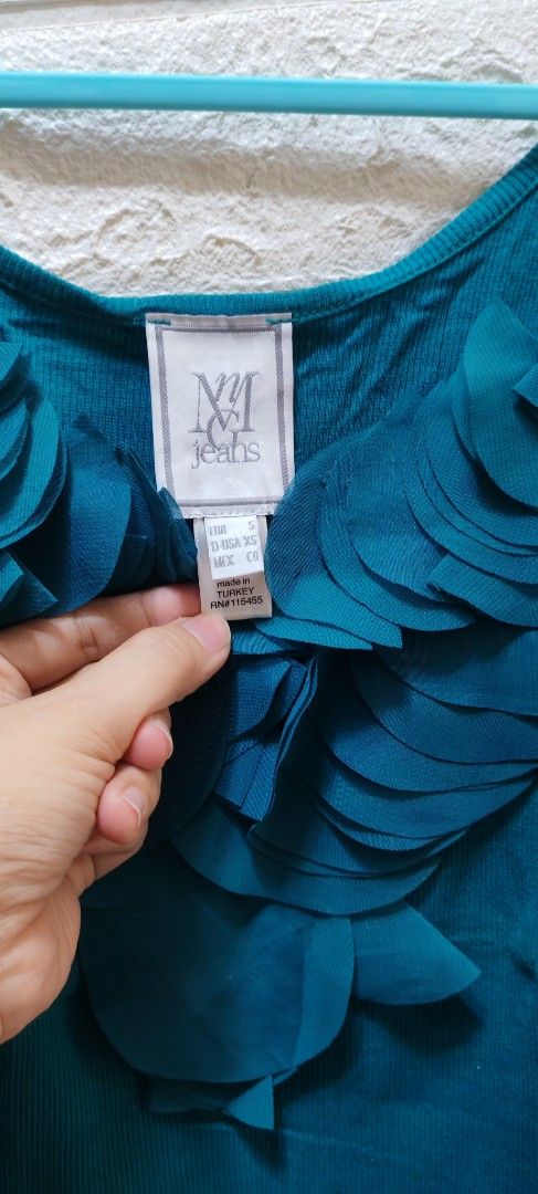 Mango top/sleeveless (Category: Sleeveless) located in Rizal. Submitted by annmaria_declutter (Listing ID 1442435342, Image 2). Description: - Teal tank top from NYC Jeans - Ribbed fabric texture - Pretty floral applique design on the front - Versatile for layering or wearing solo - Simple and chic style.