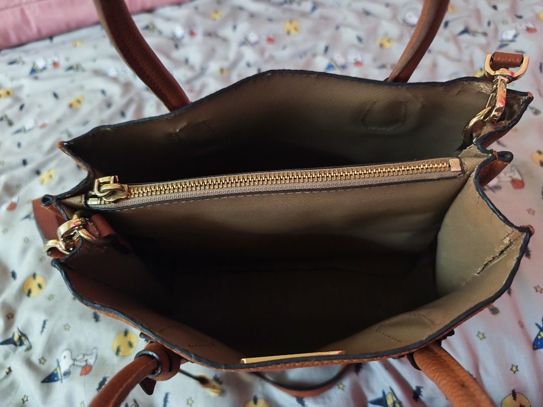 Michael Kors Leather Satchel Bag Orange (Category: Luxury Bags & Wallets) located in Quezon City. Submitted by sweetiejoy (Listing ID 1442405942, Image 3). Description: Orange pebbled leather Michael Kors satchel. Has top handles and a detachable crossbody strap. Gold hardware details, including a small lock charm. Interior has a zip pocket. Some minor marks on the leather, shown in photos..