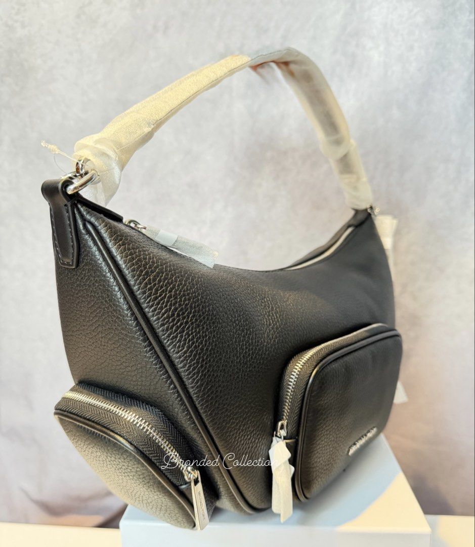 Michael Kors Merritt Medium Suede Bag Black (Category: Luxury Bags & Wallets) located in Manila. Submitted by usbrandedcollections (Listing ID 1442478374, Image 2). Description: SKU: BAG-MKC-0023 Merritt Medium Suede Convertible Shoulder Bag Black, 100% suede, 60% polyurethane 40% polyester. Gild tone hardware. 12.5”W X 8.25”W X 4.5”D, handle drop 12”. Adjustable 20”-23.5”. Front zip pocket, 2 side zip pockets detachable strap. Back zip pocket. 1