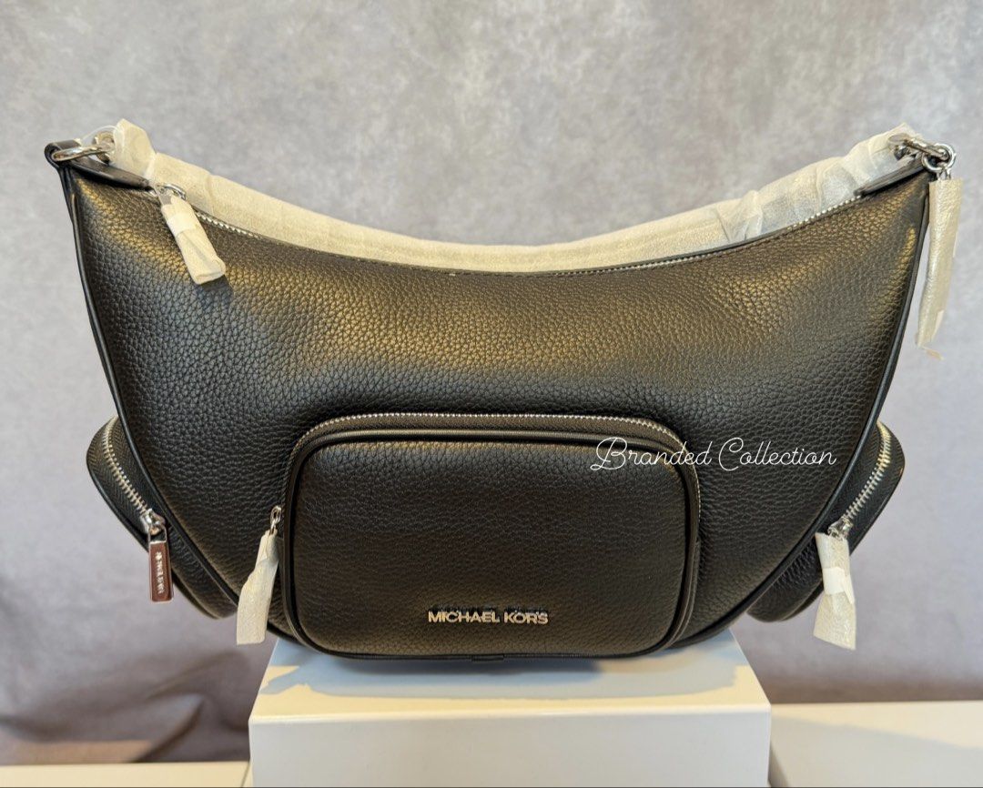 Michael Kors Merritt Medium Suede Bag Black (Category: Luxury Bags & Wallets) located in Manila. Submitted by usbrandedcollections (Listing ID 1442478374, Image 1). Description: SKU: BAG-MKC-0023 Merritt Medium Suede Convertible Shoulder Bag Black, 100% suede, 60% polyurethane 40% polyester. Gild tone hardware. 12.5”W X 8.25”W X 4.5”D, handle drop 12”. Adjustable 20”-23.5”. Front zip pocket, 2 side zip pockets detachable strap. Back zip pocket. 1