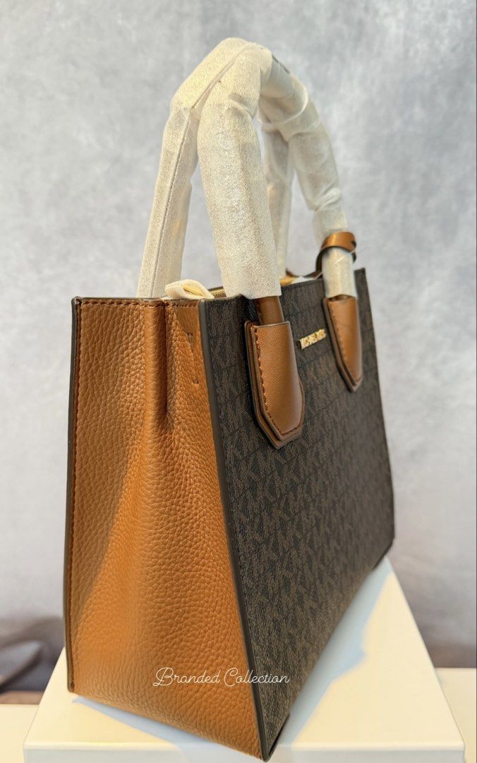 MK Mercer Crossbody Brown (Category: Cross-body Bags) located in Manila. Submitted by usbrandedcollections (Listing ID 1442353278, Image 3). Description: SKU: BAG-MKC-0023 Mercer Medium Crossbody Bag Brown Brun. Crafted from signature-print canvas and leather, our two-tone bag is updated with accordion side gussets. Removable shoulder strap. 90% coated canvas 9% polyester 1% polyurethane. Trim 100% leather. Gold tone hardware. 8.75”W X 7.5”W X 4”