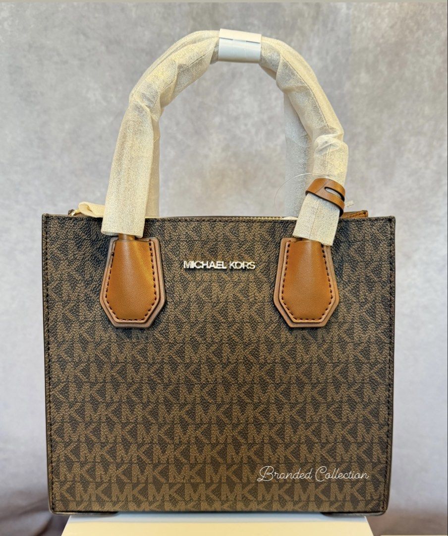 MK Mercer Crossbody Brown (Category: Cross-body Bags) located in Manila. Submitted by usbrandedcollections (Listing ID 1442353278, Image 1). Description: SKU: BAG-MKC-0023 Mercer Medium Crossbody Bag Brown Brun. Crafted from signature-print canvas and leather, our two-tone bag is updated with accordion side gussets. Removable shoulder strap. 90% coated canvas 9% polyester 1% polyurethane. Trim 100% leather. Gold tone hardware. 8.75”W X 7.5”W X 4”