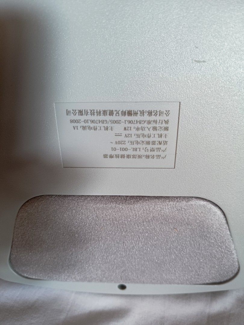 Neck Massager with Remote Control (Category: Massage Devices) located in Baguio. Submitted by clothes.over.bros.ph_2020 (Listing ID 1442383796, Image 3). Description: - White neck massager with separate remote control - Remote features digital display, heat, intensity, and power buttons - Main unit has power button and speaker grille - Multiple massage modes for a customized experience - Ideal for soothing tired neck after a long day.