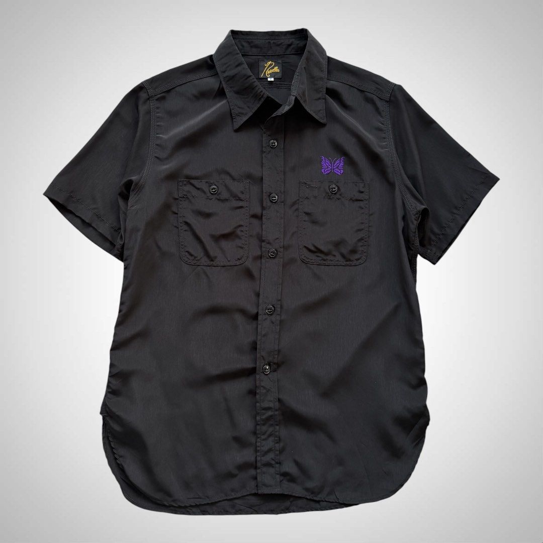 Needles Japan Black Work Buttondown Shirt (Category: Tshirts & Polo Shirts ) located in Zamboanga. Submitted by the.angura.store (Listing ID 1442358528, Image 1). Description: Needles Black Work Button-Down Shirt Short sleeve plain-woven shirt in black featuring graphics embroidered in purple in front. 2 chest pockets with buttons. Made in Japan. Measurements: -Shoulder: 17 inches -Chest: 21 inches -Length: 29 inches -Sleve length: 9.5 inches Ava