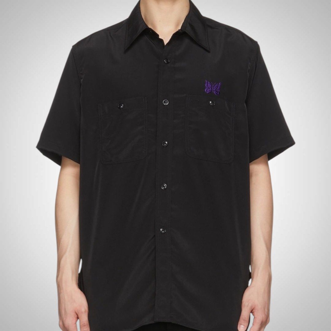 Needles Japan Black Work Buttondown Shirt (Category: Tshirts & Polo Shirts ) located in Zamboanga. Submitted by the.angura.store (Listing ID 1442358528, Image 2). Description: Needles Black Work Button-Down Shirt Short sleeve plain-woven shirt in black featuring graphics embroidered in purple in front. 2 chest pockets with buttons. Made in Japan. Measurements: -Shoulder: 17 inches -Chest: 21 inches -Length: 29 inches -Sleve length: 9.5 inches Ava