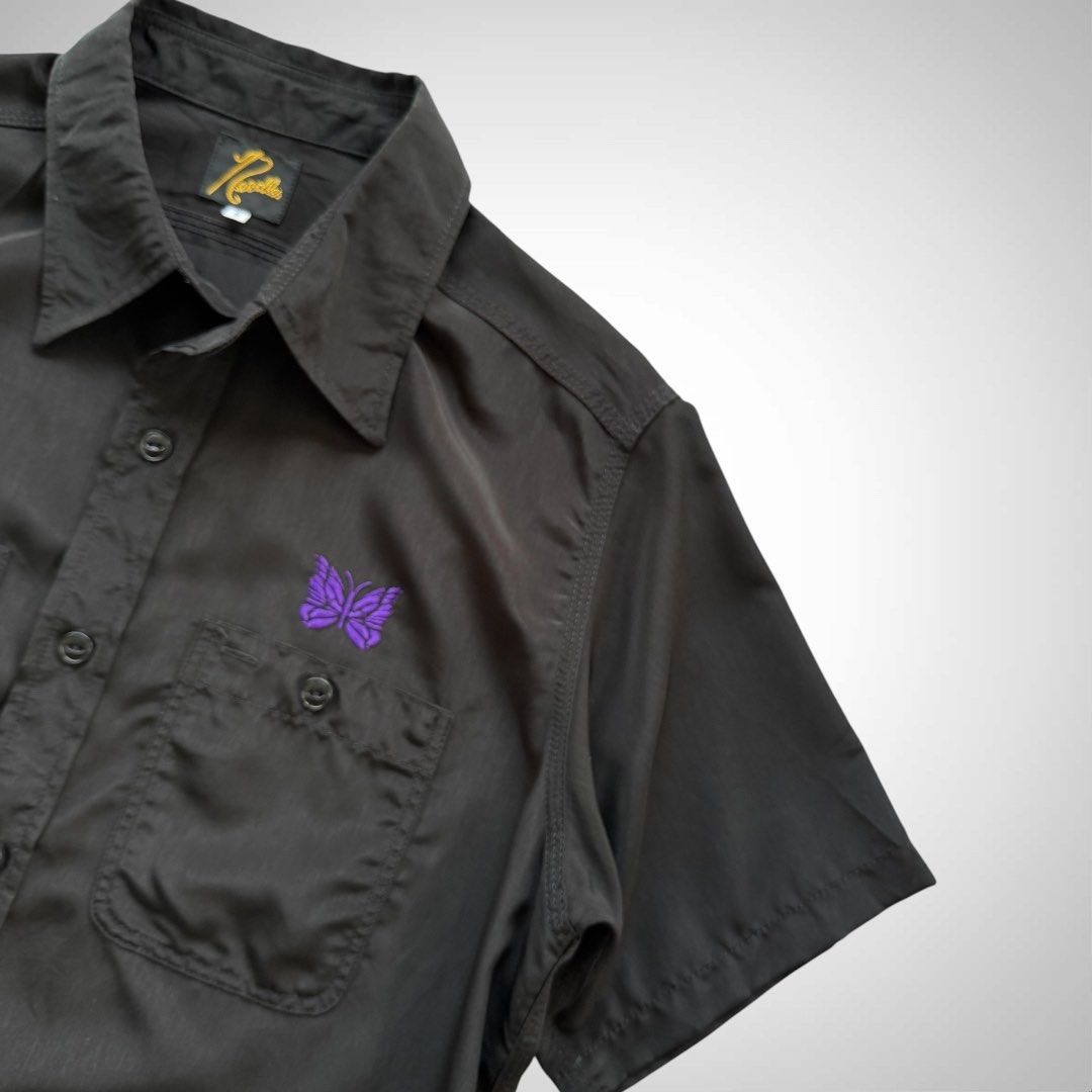 Needles Japan Black Work Buttondown Shirt (Category: Tshirts & Polo Shirts ) located in Zamboanga. Submitted by the.angura.store (Listing ID 1442358528, Image 3). Description: Needles Black Work Button-Down Shirt Short sleeve plain-woven shirt in black featuring graphics embroidered in purple in front. 2 chest pockets with buttons. Made in Japan. Measurements: -Shoulder: 17 inches -Chest: 21 inches -Length: 29 inches -Sleve length: 9.5 inches Ava