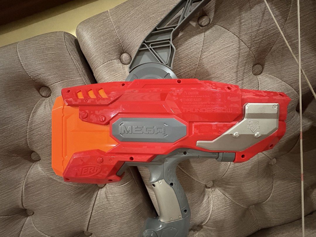 Nerf Mega ThunderBow blasters (Category: Action & Battle Toys) located in Manila. Submitted by dig76 (Listing ID 1442419861, Image 3). Description: 2 pcs available Hasbro Nerf Mega ThunderBow blasters featuring red and orange plastic bodies with grey bow arms..