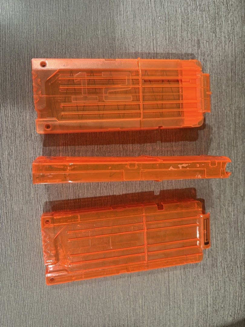 Nerf N-Strike Elite 12-round quick reload magazine. (Category: Action & Battle Toys) located in Manila. Submitted by dig76 (Listing ID 1442431155, Image 3). Description: P200 each This is a Nerf N-Strike Elite 12-round quick reload magazine. It is made of a clear orange plastic, allowing you to see the remaining darts. The magazine is designed for use with most Nerf Elite blasters..