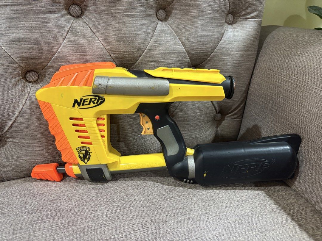 Nerf N-Strike Magstrike CS-6 Blaster Yellow Orange (Category: Action & Battle Toys) located in Manila. Submitted by dig76 (Listing ID 1442424918, Image 3). Description: FAULTY GUN - Yellow and orange Nerf N-Strike Magstrike CS-6 blaster - Includes large black barrel attachment - Shows minor scuffs and marks from play - Fully functional, still fires darts - Perfect for collectors or for playtime.
