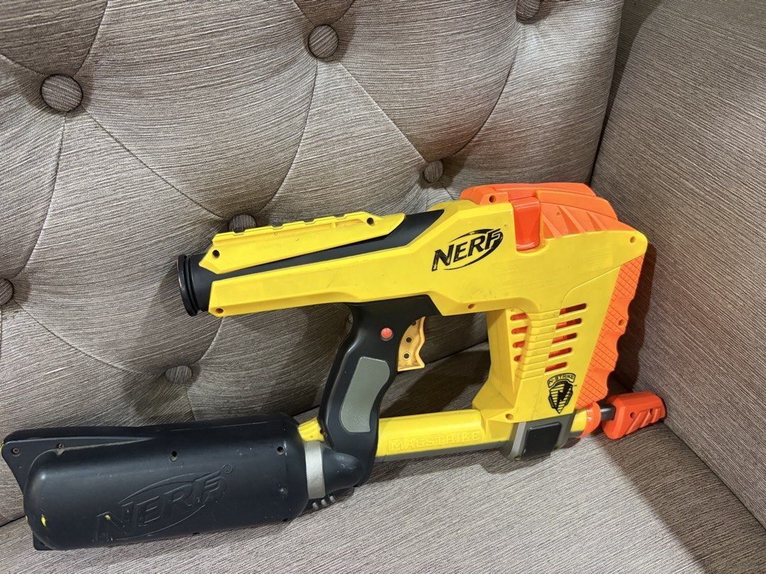 Nerf N-Strike Magstrike CS-6 Blaster Yellow Orange (Category: Action & Battle Toys) located in Manila. Submitted by dig76 (Listing ID 1442424918, Image 2). Description: FAULTY GUN - Yellow and orange Nerf N-Strike Magstrike CS-6 blaster - Includes large black barrel attachment - Shows minor scuffs and marks from play - Fully functional, still fires darts - Perfect for collectors or for playtime.