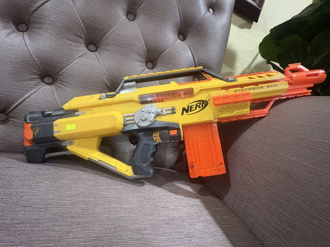 Nerf Stampede ECS Toy Gun (Category: Action & Battle Toys) located in Manila. Submitted by dig76 (Listing ID 1442411001, Image 1). Description: Lightly used Good condition - Yellow and orange Nerf Stampede ECS toy gun - Includes the magazine - Shows scuffs and marks from normal play - Great for kids who love action toys - Ready for fun battles.