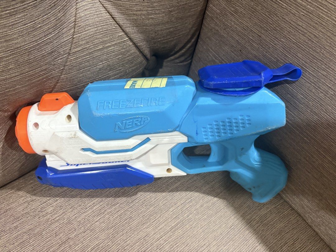 Nerf Super Soaker Freeze Fire Water Blaster Toy (Category: Action & Battle Toys) located in Manila. Submitted by dig76 (Listing ID 1442429192, Image 2). Description: - Blue and white Nerf Super Soaker Freeze Fire water blaster - Pump action for easy use - Perfect for outdoor fun and water battles - Shows minor scuffs and marks from normal play - Fully functional and works well.