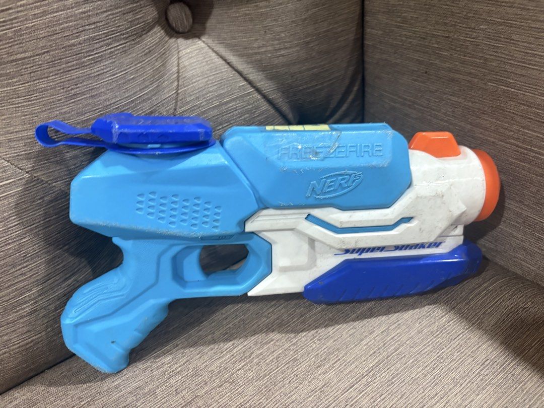 Nerf Super Soaker Freeze Fire Water Blaster Toy (Category: Action & Battle Toys) located in Manila. Submitted by dig76 (Listing ID 1442429192, Image 3). Description: - Blue and white Nerf Super Soaker Freeze Fire water blaster - Pump action for easy use - Perfect for outdoor fun and water battles - Shows minor scuffs and marks from normal play - Fully functional and works well.