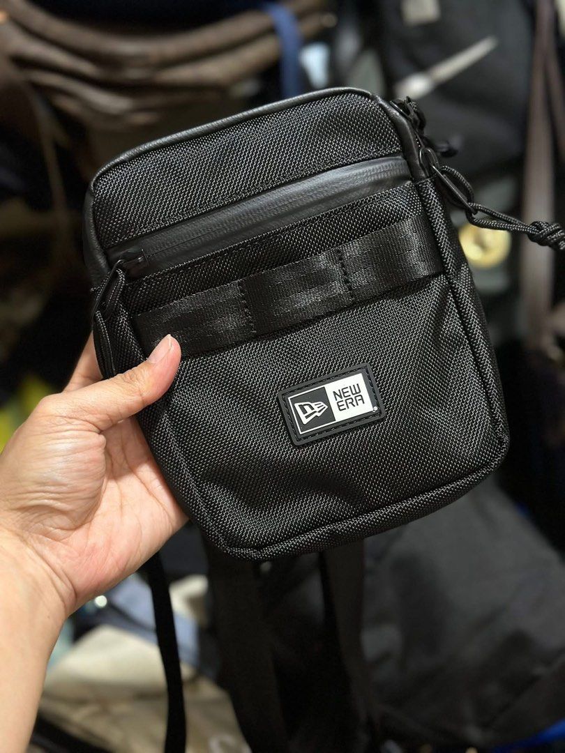 New Era Black Crossbody Bag (Category: Luxury Bags & Wallets) located in Baguio. Submitted by annecicat (Listing ID 1442415626, Image 1). Description: - Brand: New Era - Color: Black - Style: Crossbody Bag - Features: Main zippered compartment, front zippered pocket - Strap: Adjustable - Ideal for: Everyday use, carrying essentials like phone, wallet, and keys.