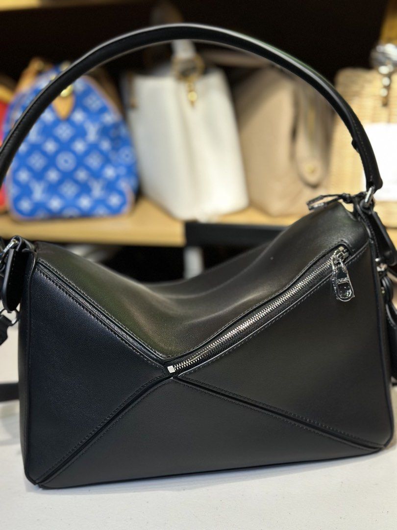 New loewe puzzle shoulder bag (Category: Luxury Bags & Wallets) located in Manila. Submitted by luxuryprelovedselection (Listing ID 1442536322, Image 3). Description: JUST LANDED & ONHAND ✨ Loewe Puzzle Edge Shoulder Bag Black Smooth Leather, Silver Hardware Effortless sling or top handle carry One stock only. Message us to reserve!.