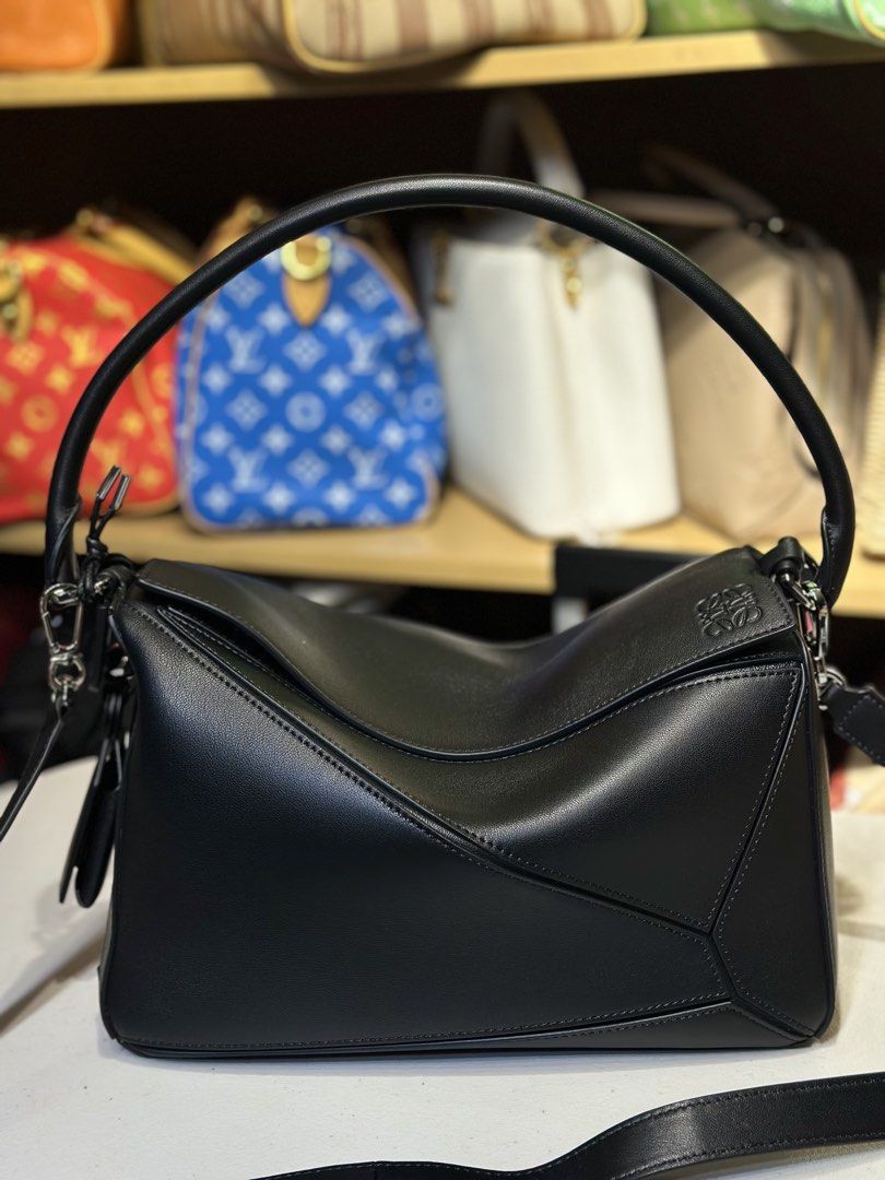 New loewe puzzle shoulder bag (Category: Luxury Bags & Wallets) located in Manila. Submitted by luxuryprelovedselection (Listing ID 1442536322, Image 1). Description: JUST LANDED & ONHAND ✨ Loewe Puzzle Edge Shoulder Bag Black Smooth Leather, Silver Hardware Effortless sling or top handle carry One stock only. Message us to reserve!.