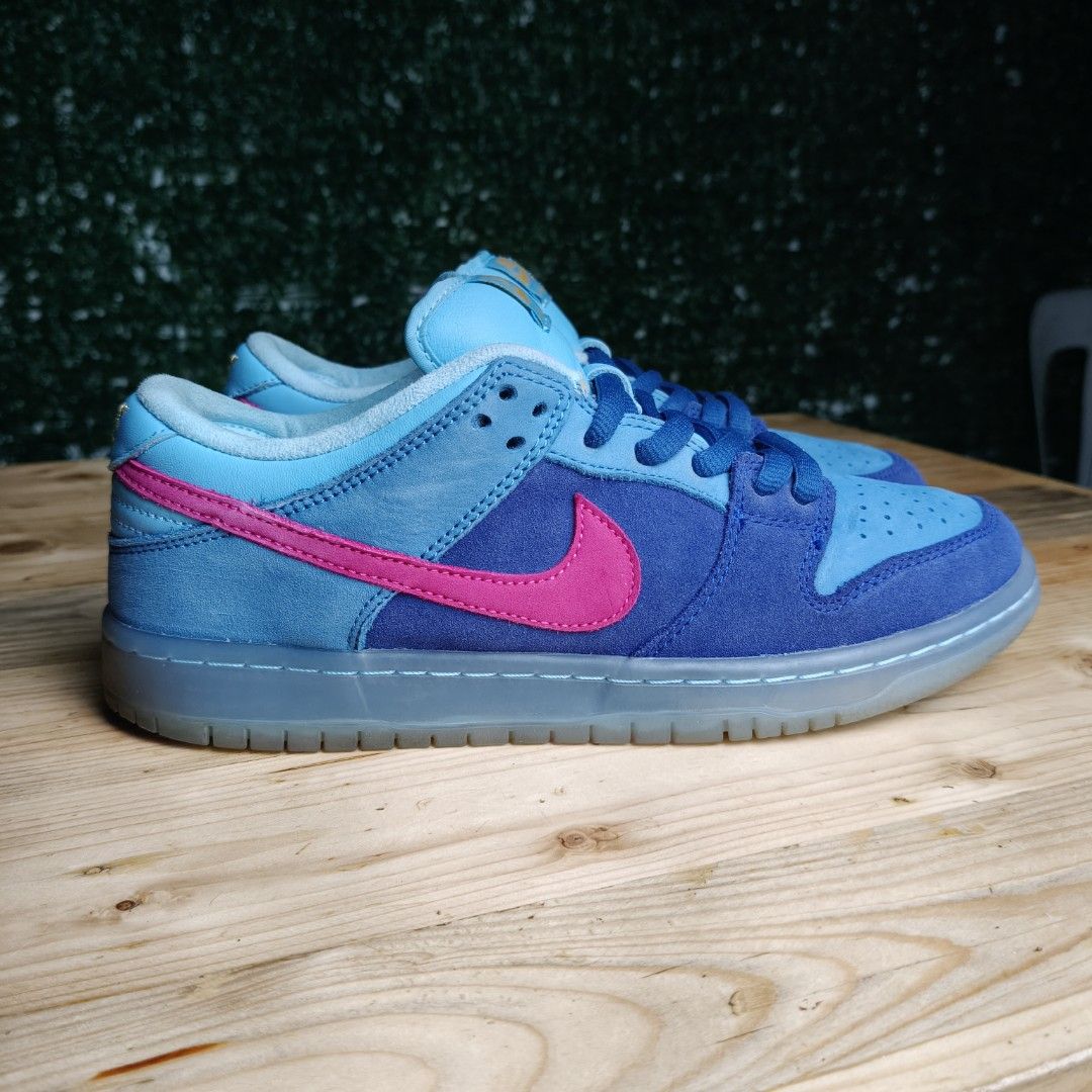 Nike SB Dunk Low " Run The Jewels " (Category: Sneakers) located in Tabaco. Submitted by souththrift4512 (Listing ID 1442509928, Image 3). Description: - Authentic Nike SB Dunk Low " Run The Jewels " - Striking blue and light blue colorway with vibrant pink accents - Signature Nike SB branding on the tongue - Unique translucent grey soles - Ideal for both everyday style and skateboarding performance no box and replaced insole pads.