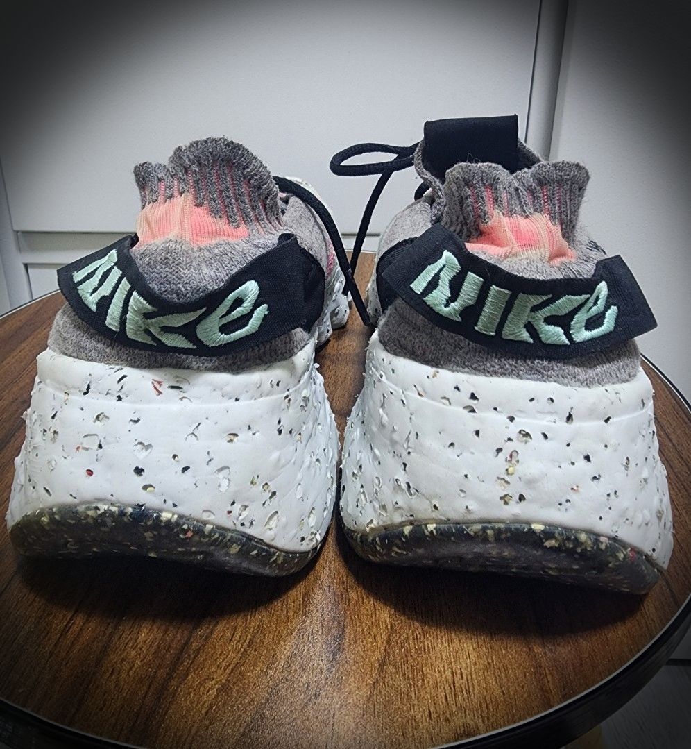 Nike Space Hippie 04 South Beach (Category: Sneakers) located in San Jose del Monte. Submitted by lberry08 (Listing ID 1442380063, Image 2). Description: Original Nike Space Hippie 04 sneakers. Smoke grey knit with pink/mint accents. Recycled speckled sole. Lace-up. Good for daily wear/light workouts. Made in Vietnam. With signs of wear/glue residue(check posted pictures for the details). Negotiable. 25cm in size..