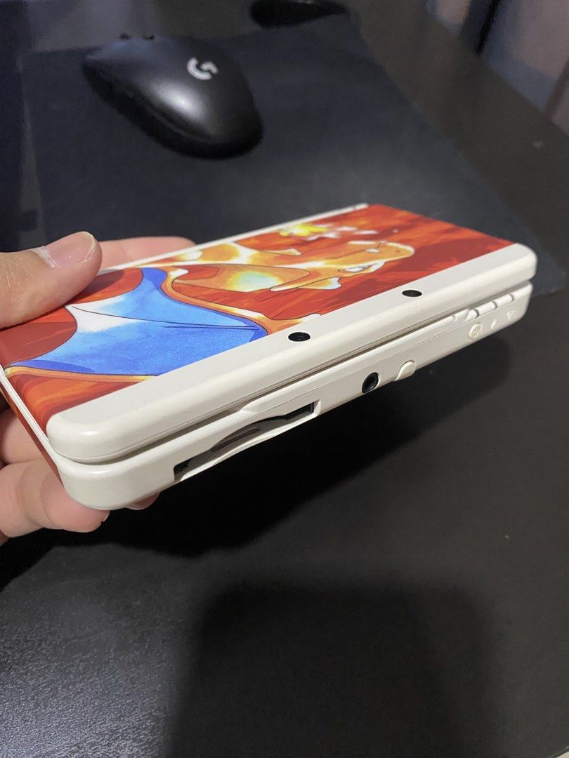 Nintendo new 3DS Pokemon 20th Anniversary Charizard (Category: Nintendo) located in Manila. Submitted by jcestillore (Listing ID 1442538574, Image 1). Description: Nintendo new 3DS Pokemon 20th anniversary Charizard Edition UNIT only Working with Custom Firmware All Original Mario 3DS case included. Stains from analog sticks. See 2nd pic. .