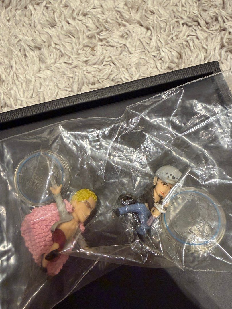 ONE PIECE COLLECTION SD Figures BANDAI Luffy Doflamingo Shanks Law Vergo (Category: Toy Figures) located in Singapore. Submitted by hobbymart (Listing ID 1442520349, Image 6). Description: One Piece SD Collection Mini Figures by BANDAI - Out of production blind boxes! Used to retail for $6.90 each, now letting each go for $3. You can also choose to try your luck (random draw) at $2.50 each, or grab all for $18 :) Displayed in glass cabinet before
