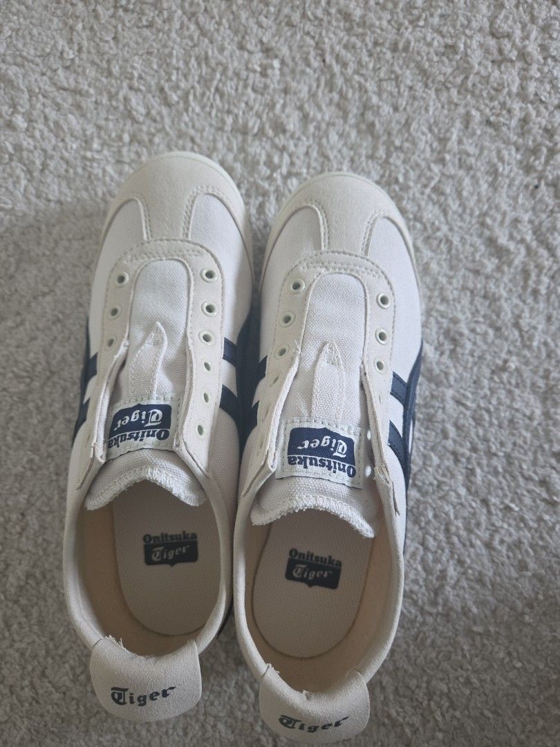Onitsuka Tiger Mexico 66 Sneakers White Navy (Category: Sneakers) located in Singapore. Submitted by haiderali12 (Listing ID 1442436146, Image 1). Description: - Classic Onitsuka Tiger Mexico 66 - Slip-on design (no laces) - White canvas with navy stripes - Perfect for everyday wear - Comfortable and stylish RFS bought wrong size. never worn before. no box price negotiable.