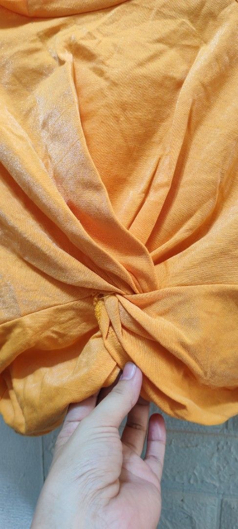 Orange Twisted Front Crop Top (Category: Others Tops) located in Rizal. Submitted by annmaria_declutter (Listing ID 1442431793, Image 2). Description: - Trendy orange crop top - Unique twisted front detail - Comfortable, soft fabric - Versatile for casual or dressed-up outfits - Pairs well with high-waisted jeans and skirts - Easy to style for a chic look -orange top na medyo shiny .