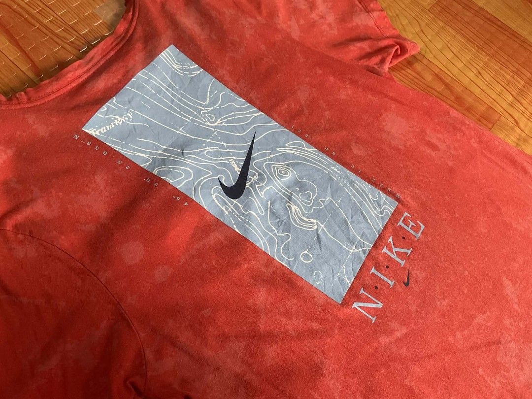 Authentic Nike Tie-Dye Pocket T-Shirt (Category: Tshirts & Polo Shirts ) located in Rosario. Submitted by tocus (Listing ID 1442418879, Image 2). Description: - Eye-catching red tie-dye design - Contrasting light blue front pocket - Unique back graphic: Nike swoosh & topographic map - Made from 100% comfortable cotton - Ideal for everyday casual wear.