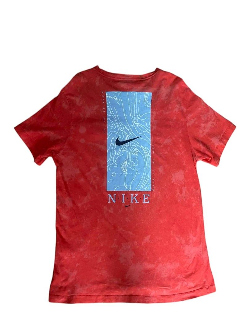 Authentic Nike Tie-Dye Pocket T-Shirt (Category: Tshirts & Polo Shirts ) located in Rosario. Submitted by tocus (Listing ID 1442418879, Image 3). Description: - Eye-catching red tie-dye design - Contrasting light blue front pocket - Unique back graphic: Nike swoosh & topographic map - Made from 100% comfortable cotton - Ideal for everyday casual wear.