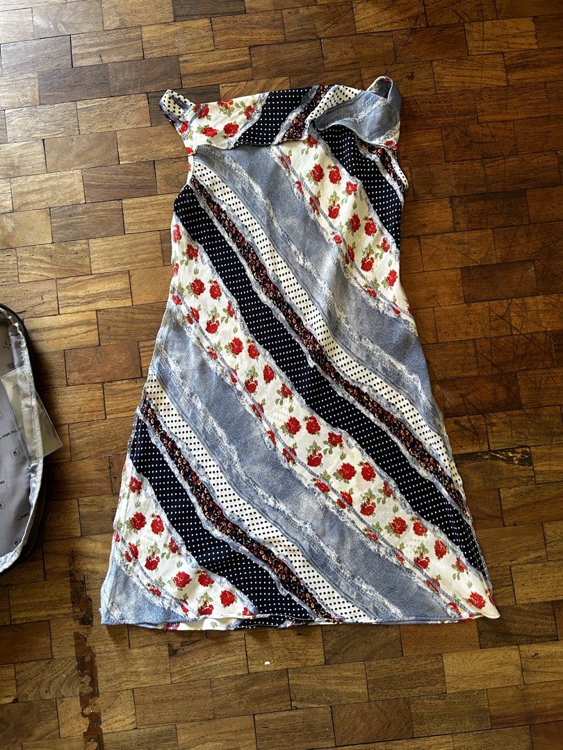 Patchwork Floral Sleeveless Mini Dress (Category: Dresses) located in Manila. Submitted by d.artchives (Listing ID 1442352848, Image 1). Description: - Fun patchwork design with a mix of floral, polka dot, and denim-like fabrics. - Features a vibrant red rose print. - Sleeveless with a unique strap detail on the shoulders. - Versatile: great for casual outings or as a stylish beach cover-up. - Eye-catching and one-of-a-kind style..