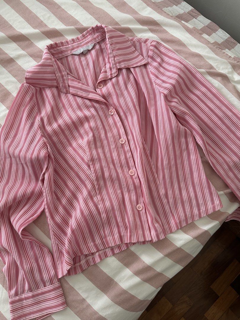Pink Striped Button-Up Blouse polo (Category: Blouses) located in Davao. Submitted by beys.corner (Listing ID 1442351045, Image 1). Description: Fits S-M - Cute pink and white striped button-up blouse - Long sleeves with button cuffs - Collared neckline - Lightweight material, ideal for layering or wearing alone - Versatile for casual or smart-casual styling.