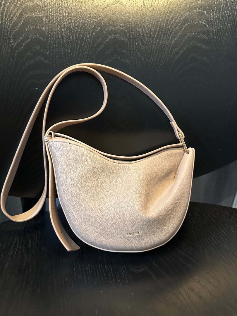 Polene Bag - White Leather Shoulder Bag (Category: Luxury Bags & Wallets) located in Las Pinas. Submitted by gabbiesobremonte20 (Listing ID 1442529223, Image 1). Description: - Polene shoulder bag in a lovely white. - Crafted from durable pebbled leather. - Elegant curved shape. - Single comfortable shoulder strap. - Stylish gold hardware detail on strap attachment. - Versatile: ideal for everyday use or dressing up your look..