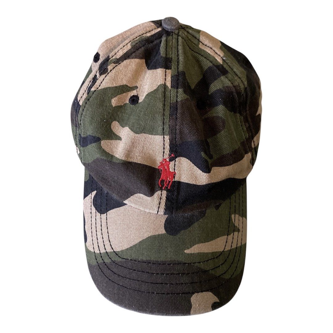 Polo Ralph Lauren Camou (Category: Caps & Hats) located in Tigaon. Submitted by rap2k (Listing ID 1442351559, Image 1). Description: - Classic camouflage baseball cap by Polo Ralph Lauren - Features iconic red Polo player logo embroidery on the front - Adjustable strap at the back for a custom fit - One size fits most - Ideal for casual and everyday wear.